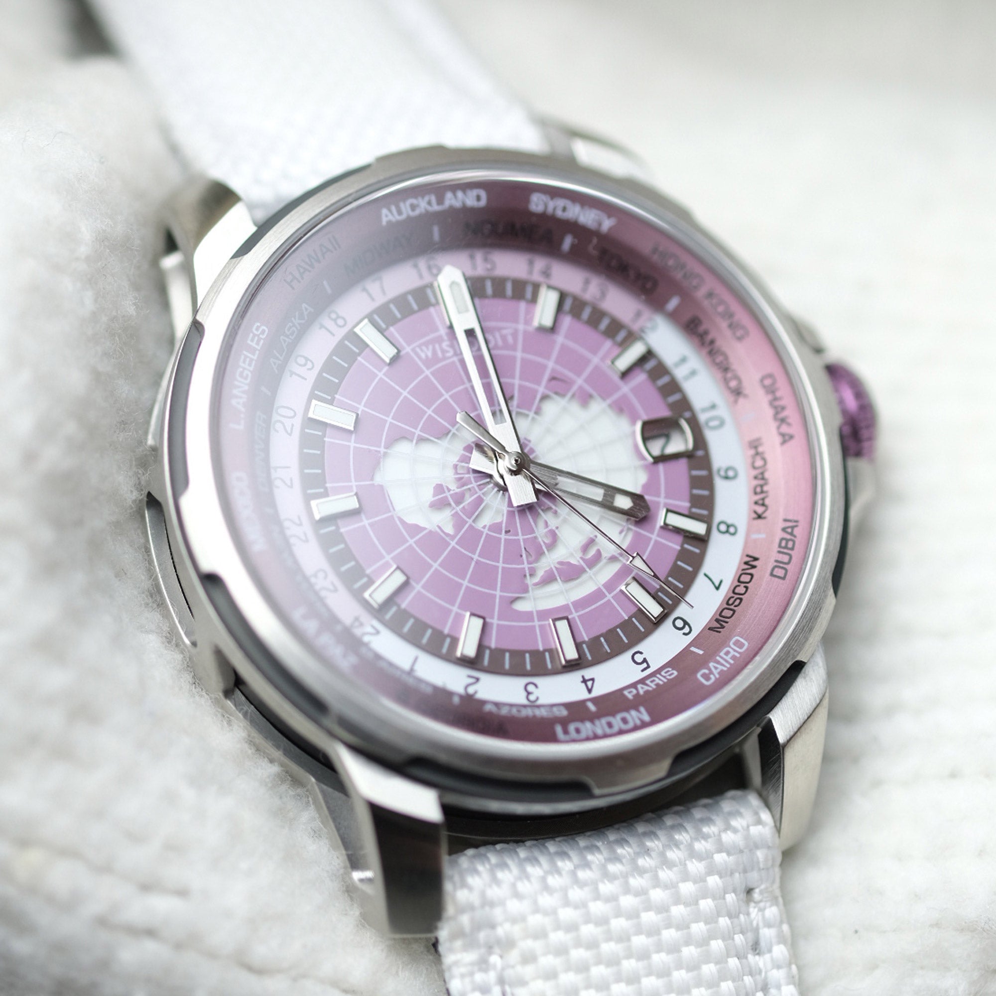 Close-up of Wishdoit GMT World Time Purple Watch with white strap, displaying intricate dial design and sapphire crystal clarity.